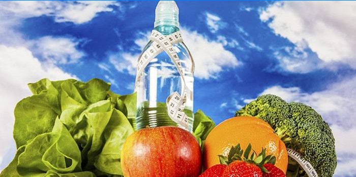 Legumes, frutas e uma garrafa de água