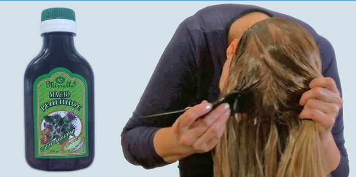Mulher coloca óleo de bardana no cabelo